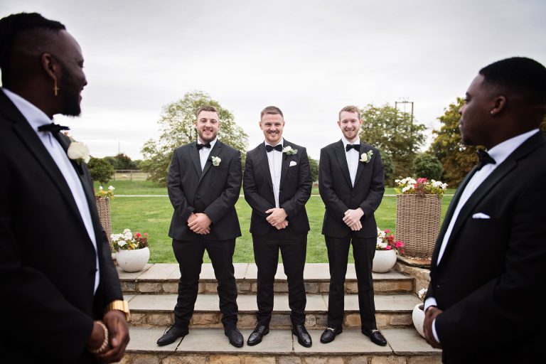 Groom and his groomsmen line up in wait for the bride at Blackwell Grange.