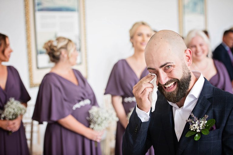 Groom crying natural photos at Margam Country Park. Photographed by Blooming Photography