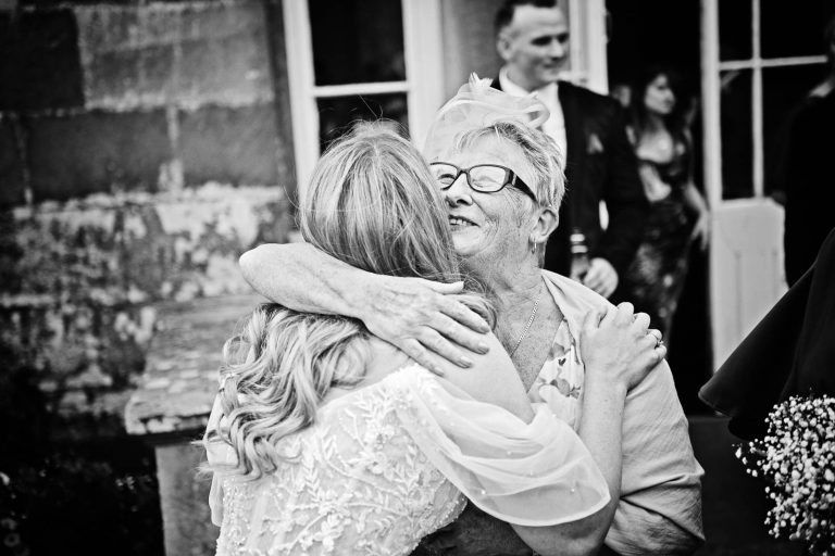 Candid moments taken by Blooming Photography at a wedding at Margam Country Park. Photo Black and white.