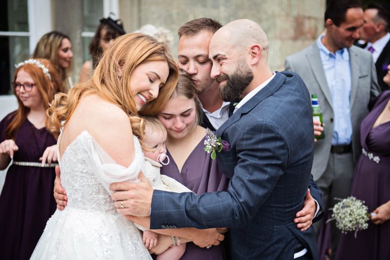 Candid, emotional and beautiful photo taken at a wedding at Margam Country Park by Blooming Photography.