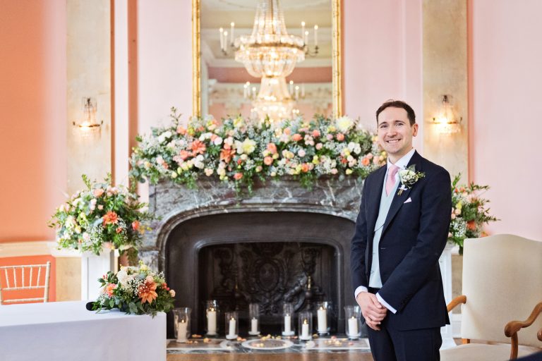 The Groom standing in anticipation for his brides entrance at the elegant Danesfield House Hotel and Spa. Photography by Blooming Photography.