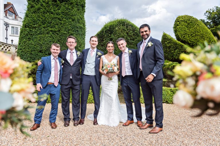 Casual group shot composition by using wedding bouquets. Photographed at Danesfield House Hotel and Spa. Photography by Ben Roberts Blooming Photography.