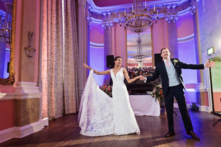 Bride and groom do their first choreographed dance. Front facing. Photographed in the elegant Danesfield House Hotel and Spa Ballroom. Photograph by Ben Roberts, Blooming Photography.