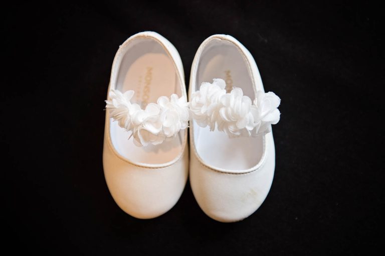 Pretty floral flower girl wedding shoes from Monsoon. Photograph by Blooming Photography