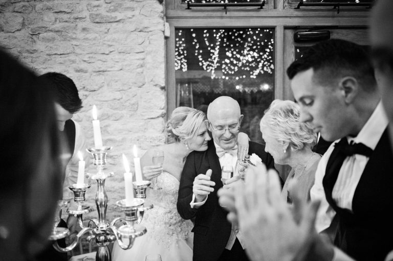 Natural emotional moment captured at Kingscote Barn by Blooming Photography