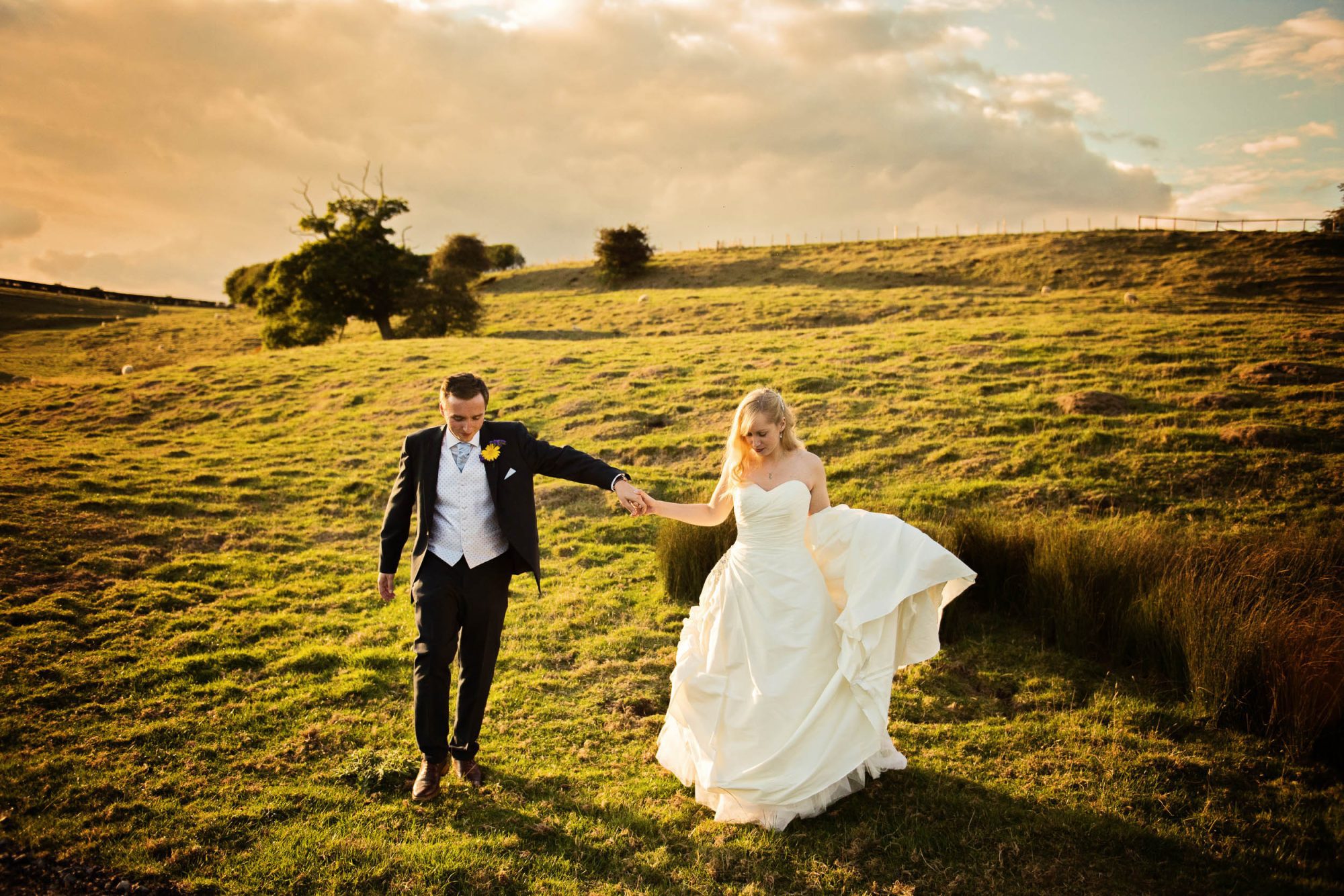Unposed sunset wedding photos at Kingscote Barn (
