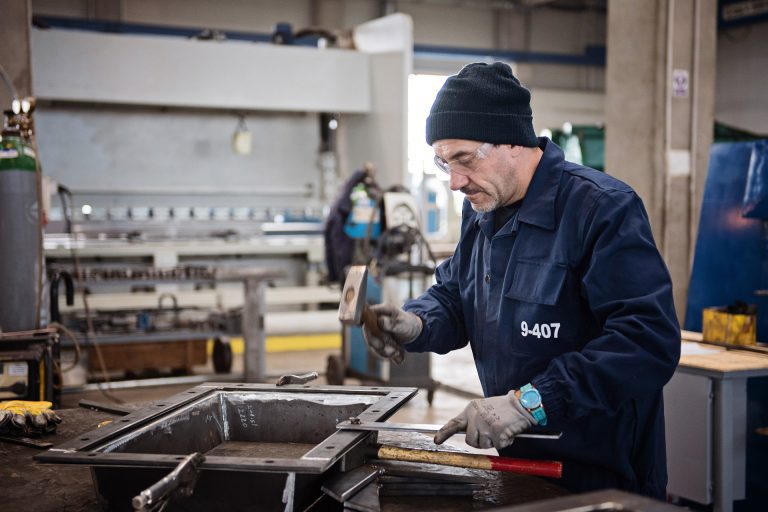 A worker creating an expansion joint in a manufacturing factory in Romania.