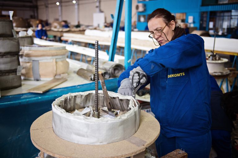 A worker creating an expansion joint in a engineering factory in Romania.