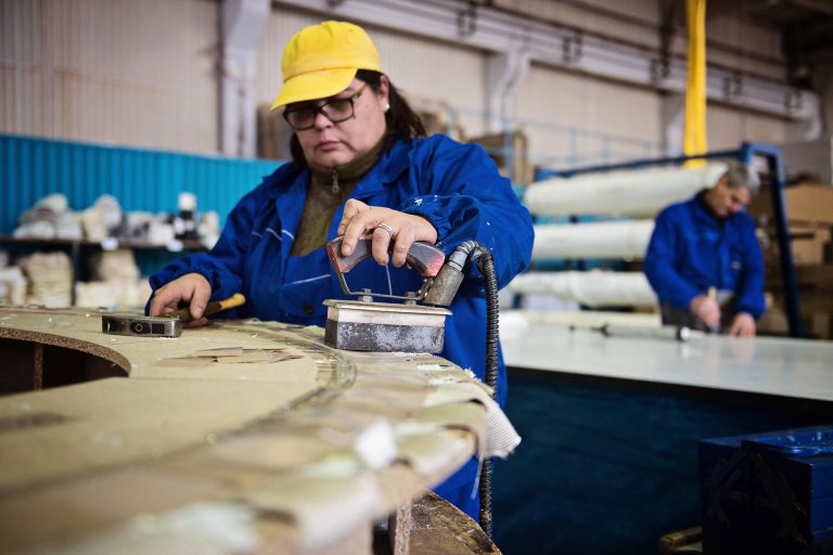 A worker creating an expansion joint in a engineering factory in Romania.
